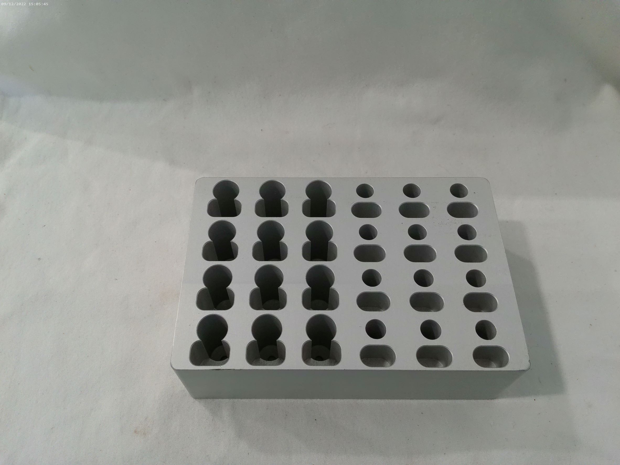 Tecan Tube Adapter, 1.5 mL Microfuge with Hinged Cap, 12-Position (4 x 3), and 0.5 mL Microfuge with Hinged cap, 12-Position (4 x 3), Microplate Format, Aluminum. Has holes for cap storage. 30012613 - Image 1
